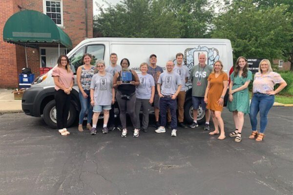 Kapnick Strive - Team Volunteering Group Photo With Business Truck